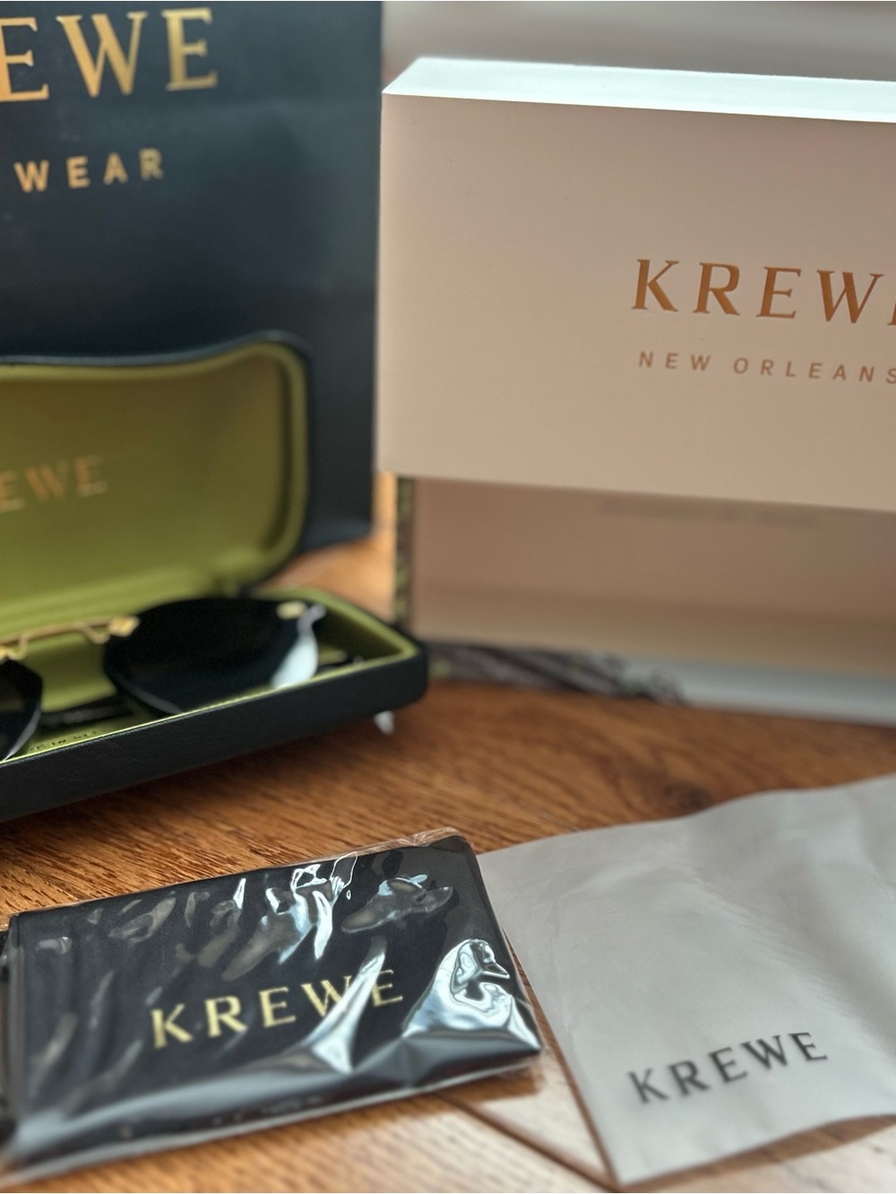 KREWE Sunglasses with Black Lenses and Gold Accents